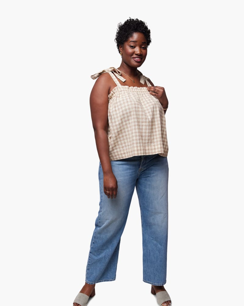 Front of a model wearing a size XXL Bryce Smocked Swing Tank in Tan Gingham by ABLE. | dia_product_style_image_id:271413